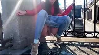 Girl pee in a bring out place